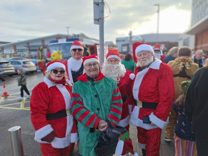 Andy with his family dressed in Christmas Costumes!